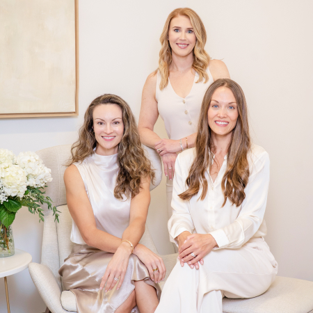 Four women highlighting teamwork in the field of oculofacial plastic surgery.