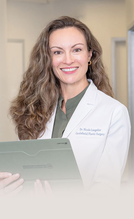 Dr. Langelier Sitting Beside Her Office Background